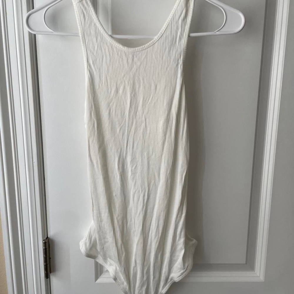 Miss Lola cream bodysuit. Cutout in back. Never worn.